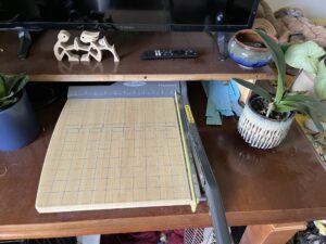 Wooden paper cutter on a table